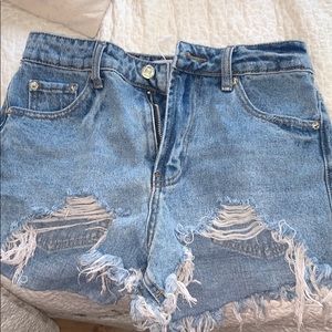 Adika Marie ripped denim shorts